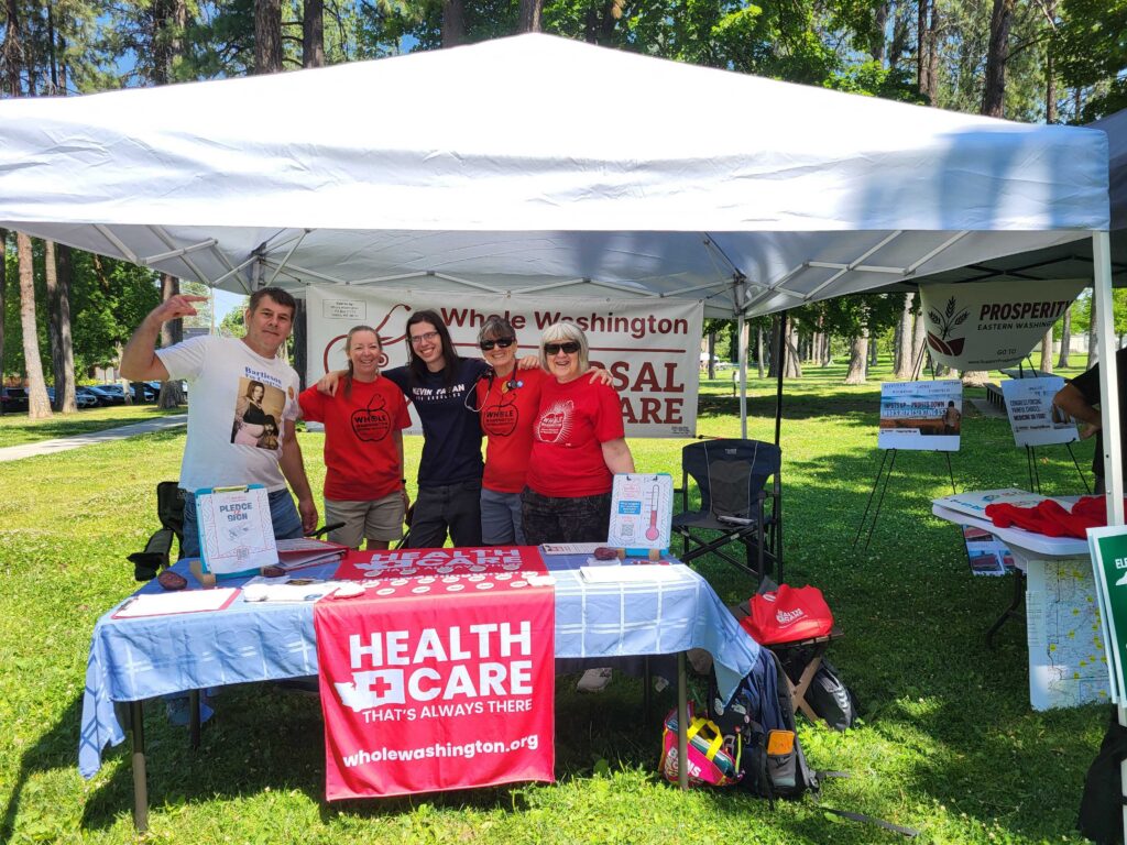 Picture of 5 Whole Washington Volunteers tabling!